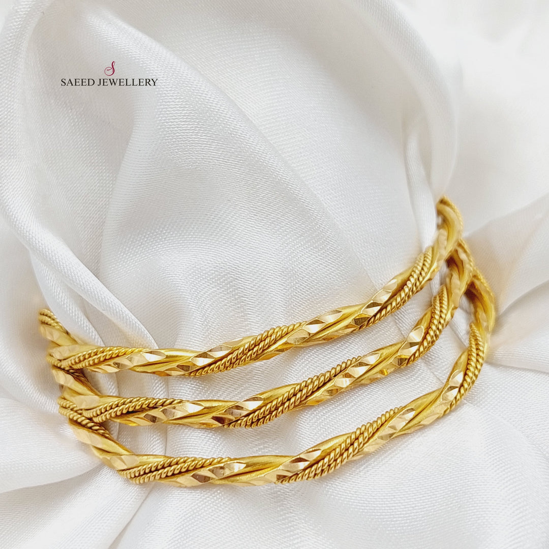 21K Gold Twisted Solid Bangle by Saeed Jewelry - Image 1