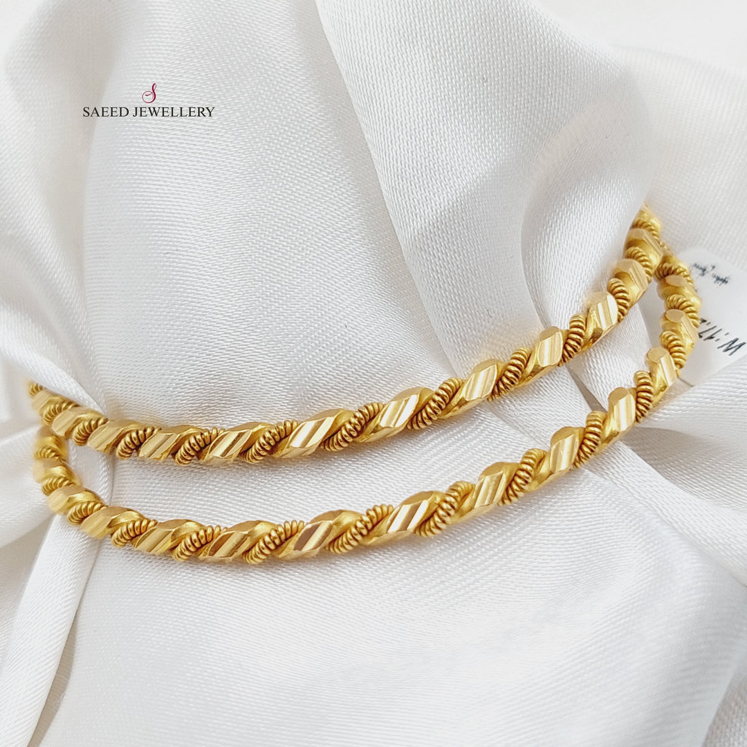 21K Gold Twisted Solid Bangle by Saeed Jewelry - Image 1