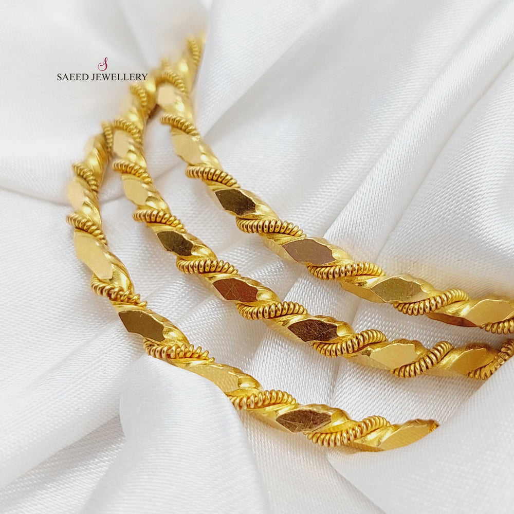 21K Gold Twisted Solid Bangle by Saeed Jewelry - Image 2