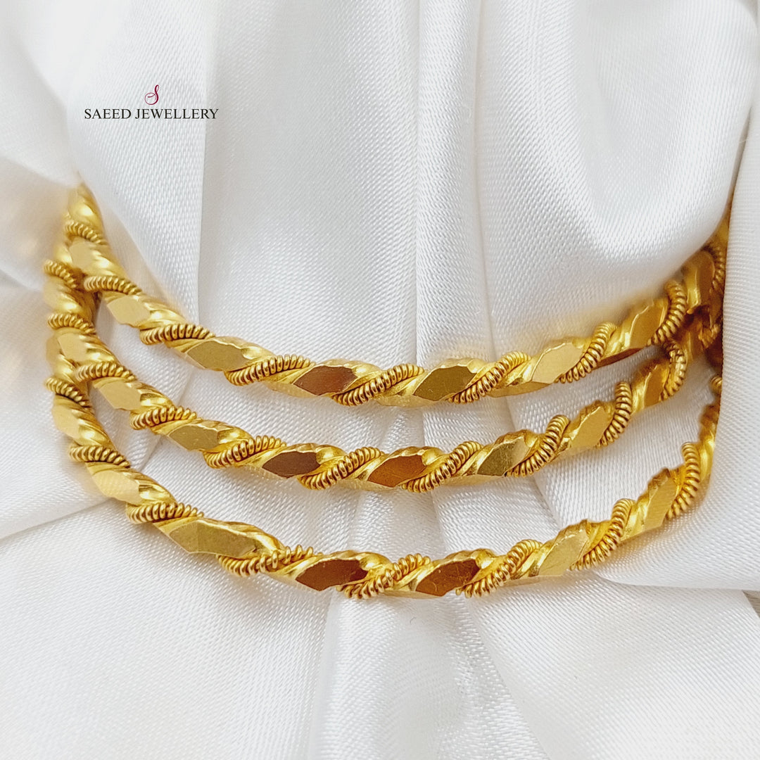 21K Gold Twisted Solid Bangle by Saeed Jewelry - Image 1