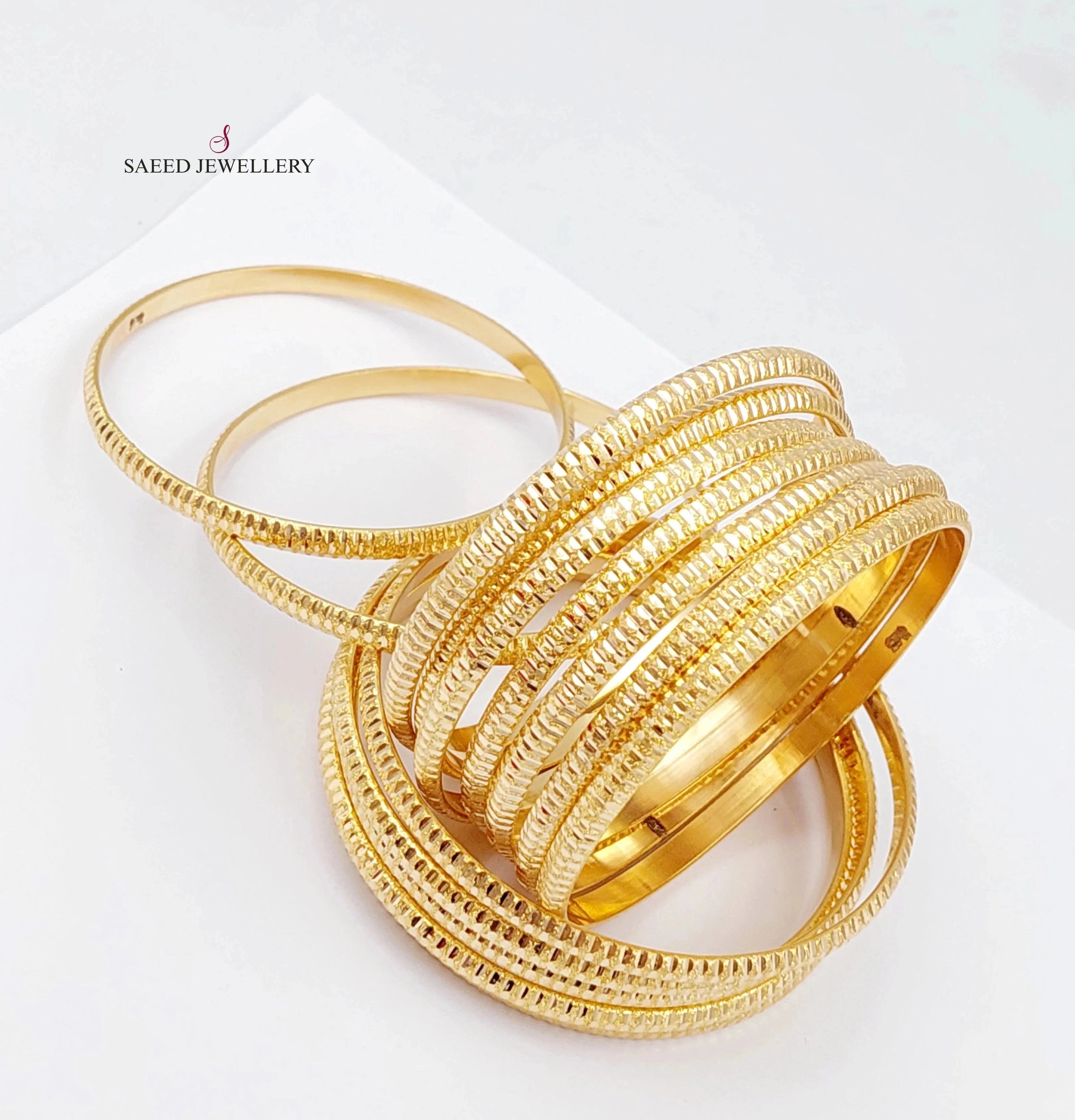 21K Gold Thin laser bangle set by Saeed Jewelry - Image 1